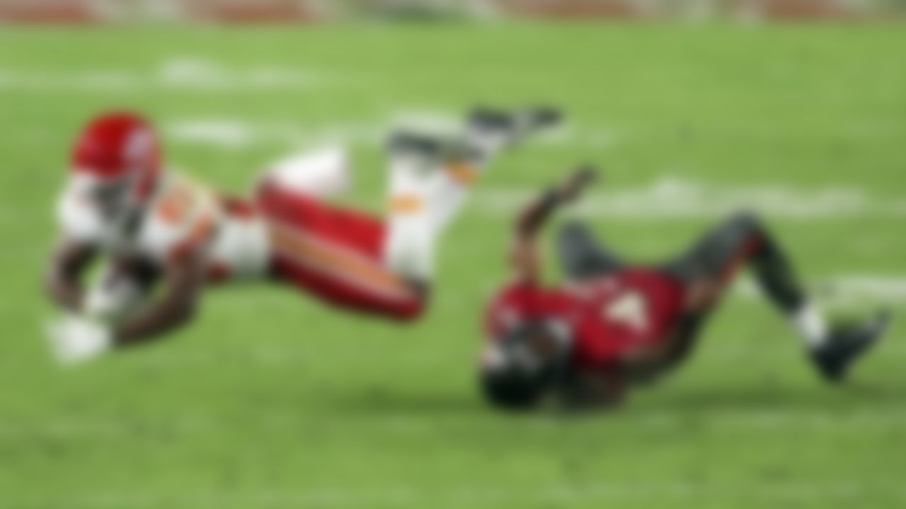 Kansas City Chiefs running back Clyde Edwards-Helaire (25) gets tripped up by Tampa Bay Buccaneers defensive back Ross Cockrell (43) during the second half of an NFL football game Sunday, Nov. 29, 2020, in Tampa, Fla.