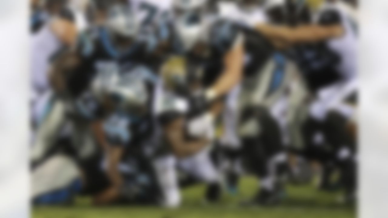 Jacksonville Jaguars running back Corey Grant (30) gets tackles by multiple Carolina Panthers defenders during a NFL preseason game, Thursday, Aug. 24, 2017 in Jacksonville, Fla. (Logan Bowles / NFL)