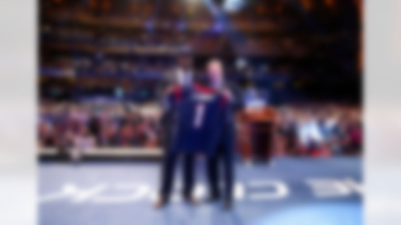 Jadeveon Clowney poses with NFL Commissioner Roger Goodell after being selected by the Houston Texans during the 2014 NFL Draft at Radio City Music Hall on May 8, 2014 in New York, NY. (Ben Liebenberg/NFL)