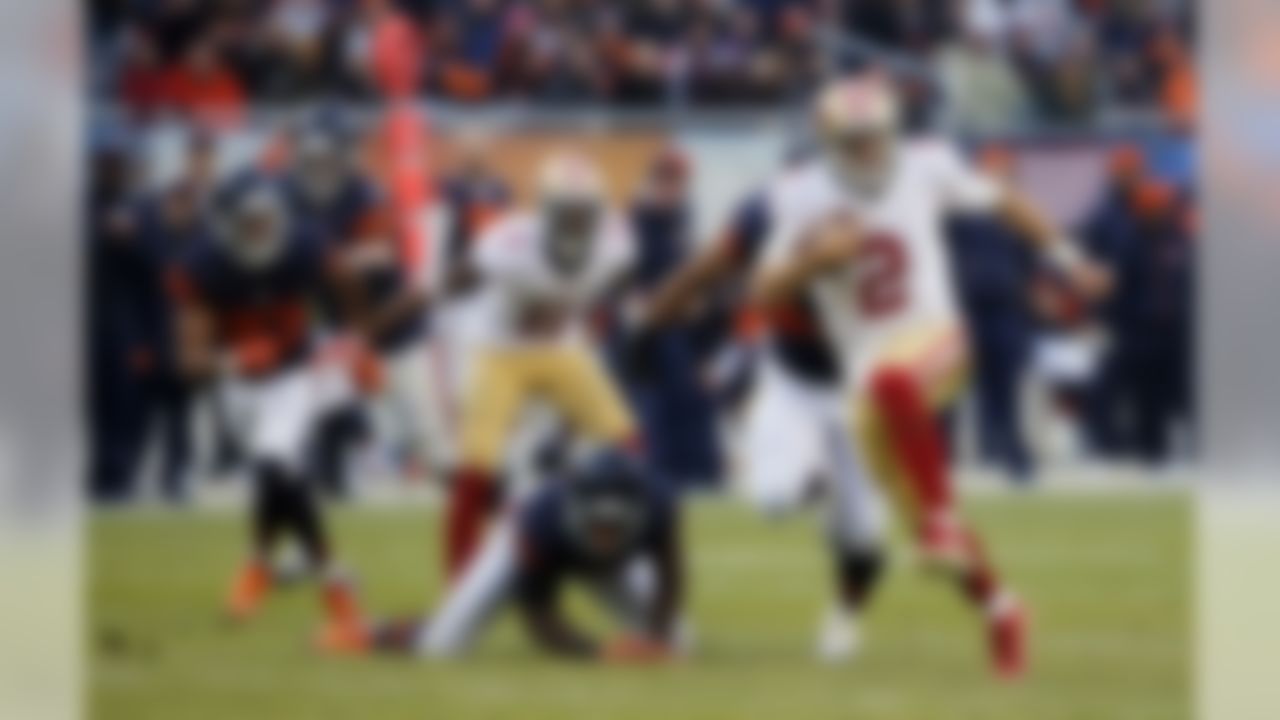 San Francisco 49ers quarterback Blaine Gabbert (2) runs to the end zone for a touchdown during the second half of an NFL football game against the Chicago Bears, Sunday, Dec. 6, 2015, in Chicago. (AP Photo/Charles Rex Arbogast)