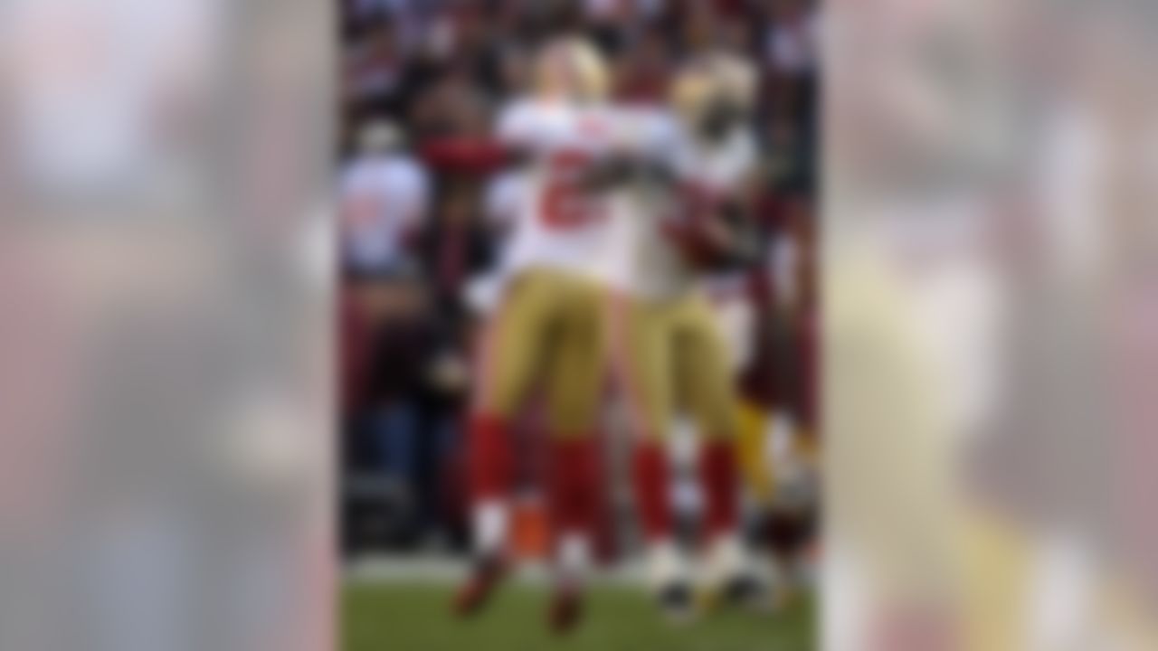 San Francisco 49ers strong safety Donte Whitner, right, celebrates with teammate Tarell Brown after recovering a fumble in the first half of an NFL football game against the Washington Redskins in Landover, Md., Sunday, Nov. 6, 2011. (AP Photo/Cliff Owen)