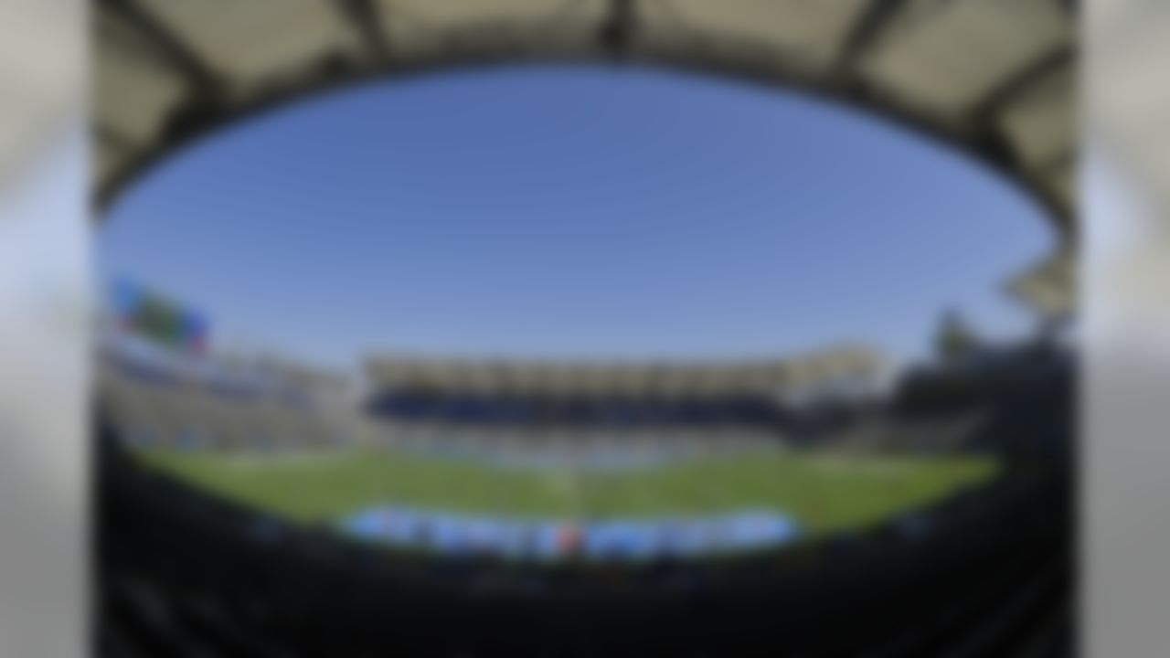 Players for the Seattle Seahawks and the Los Angeles Chargers walk on the field before a preseason NFL football game at the StubHub Center, Sunday, Aug. 13, 2017, in Carson, Calif. (AP Photo/Mark J. Terrill)