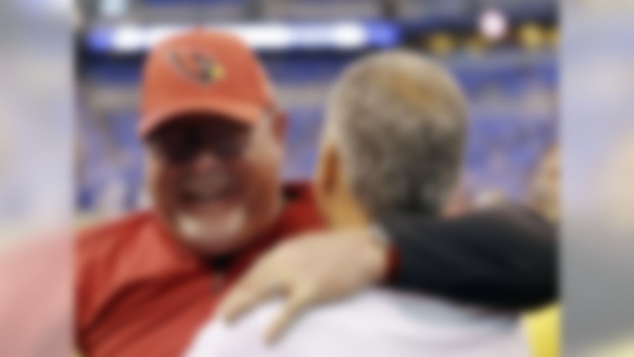 Arizona Cardinals head coach Bruce Arians, left, talks with Indianapolis Colts head coach Chuck Pagano before an NFL football game Sunday, Sept. 17, 2017, in Indianapolis. (AP Photo/AJ Mast)