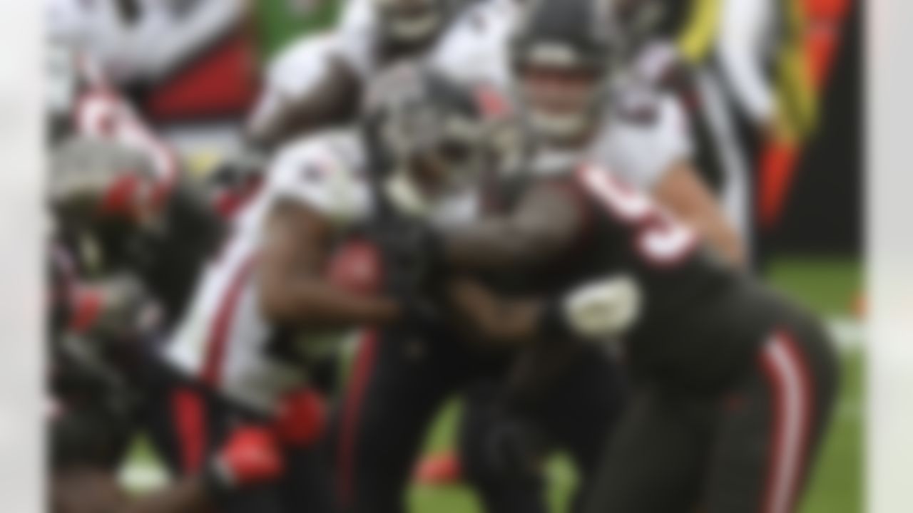 Atlanta Falcons running back Brian Hill (23) rushes against the Tampa Bay Buccaneers during the second half of an NFL football game Sunday, Jan. 3, 2021, in Tampa, Fla.