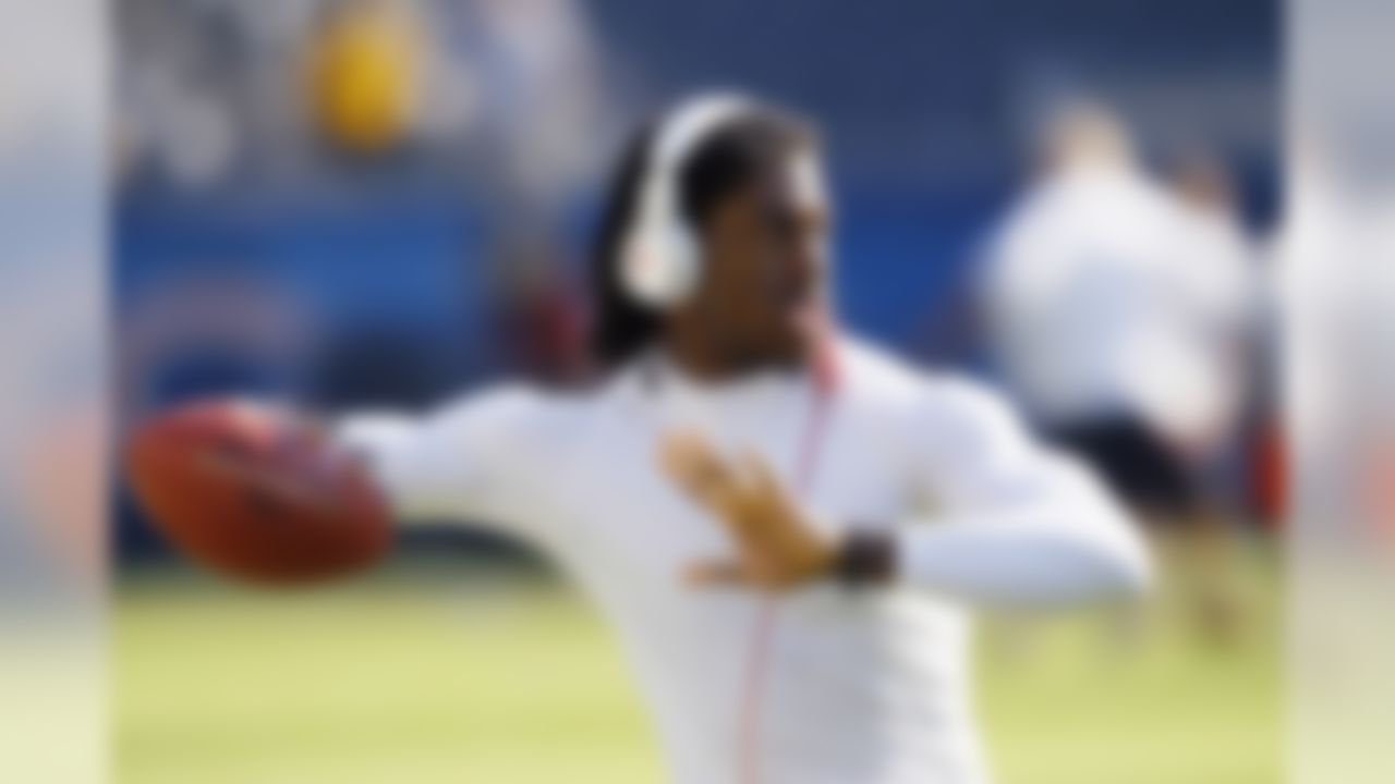 Washington Redskins quarterback Robert Griffin III warms up before an NFL preseason football game against the Chicago Bears in Chicago, Saturday, Aug. 18, 2012. (AP Photo/Charles Rex Arbogast)