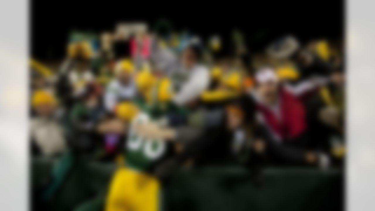 Green Bay Packers tight end Jermichael Finley (88) does a Lambeau leap during an NFL football game Monday, Dec. 7, 2009, in Green Bay, Wis. between the Baltimore Ravens and the Green Bay Packers. The Packers won 27-14. (AP Photo/Mike Roemer)