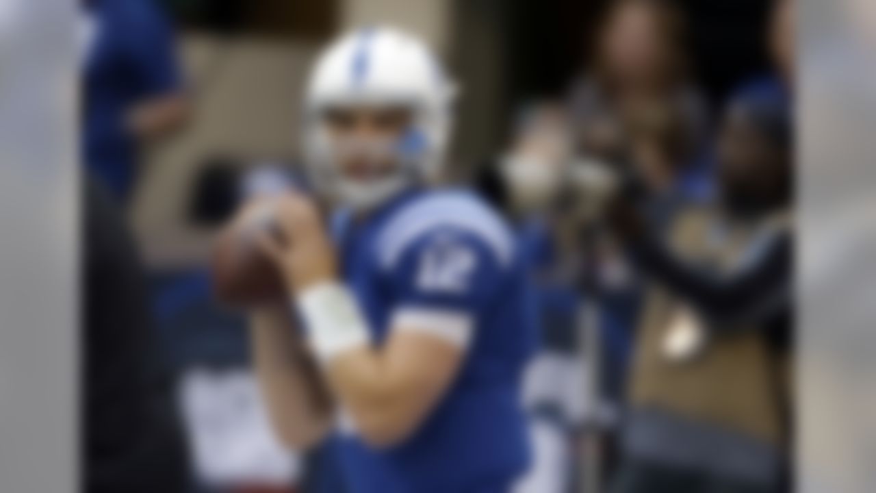 Indianapolis Colts quarterback Andrew Luck throws before an NFL football game between the Indianapolis Colts and the Baltimore Ravens in Indianapolis, Sunday, Oct. 5, 2014. (AP Photo/AJ Mast)