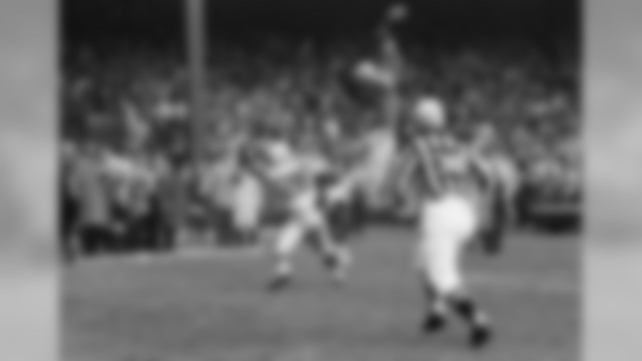 Dick (Night Train) Lane, Detroit Lions defensive end, leaping high to beat down a looping Baltimore Colts pass intended for Jimmy Orr (28) at the goal line on Dec. 3, 1962 in Detroit. With fourth down for the Colts and 11 seconds of play remaining in the game, it proved to be the play that brought the Detroit Lions a 21-14 victory. (AP Photo)