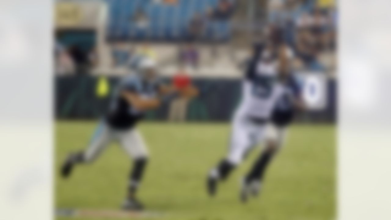 Jacksonville Jaguars wide receiver Allen Robinson (15) makes a catch against Carolina Panthers safety Kurt Coleman, left, and cornerback Daryl Worley during the first half of an NFL preseason football game, Thursday, Aug. 24, 2017, in Jacksonville, Fla. (AP Photo/Stephen B. Morton)