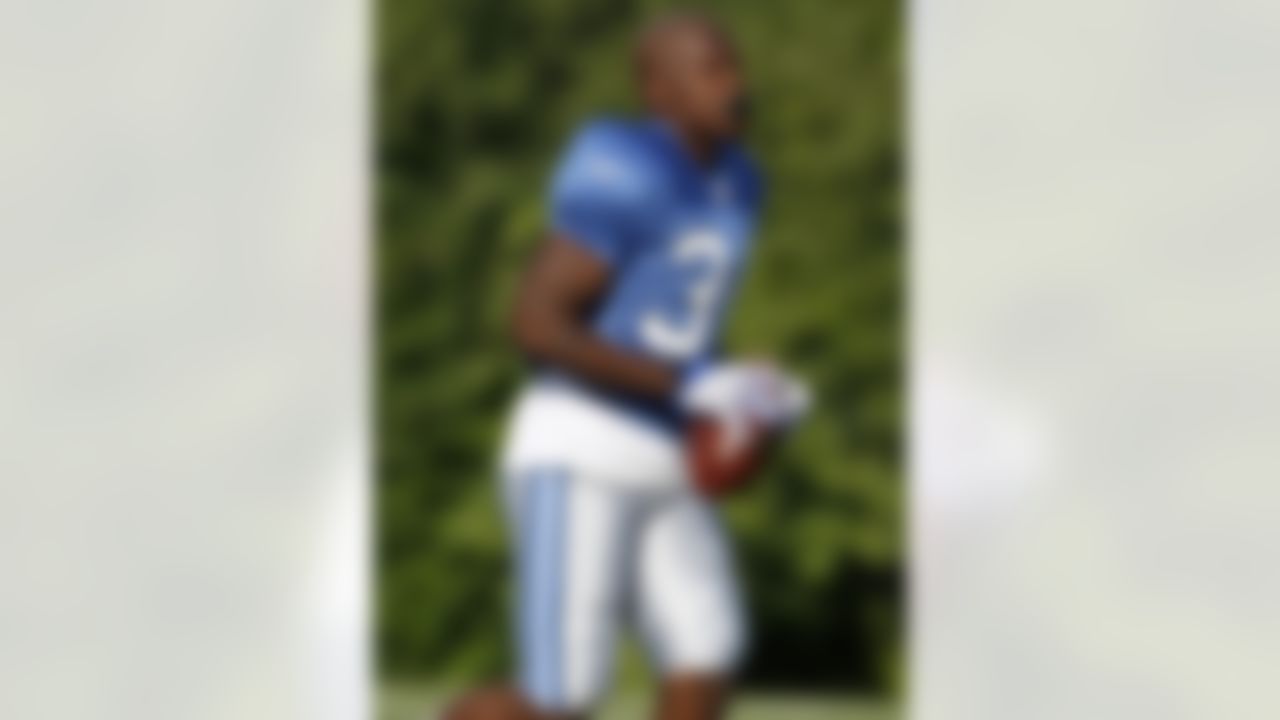 ALLEN PARK, MI - JULY 24: Kevin Smith #34 of the Detroit Lions returns to the huddle after a run during training camp at the Detroit Lions Headquarters and Training Facility on July 24, 2008 in Allen Park, Michigan. (Photo by Gregory Shamus/Getty Images)