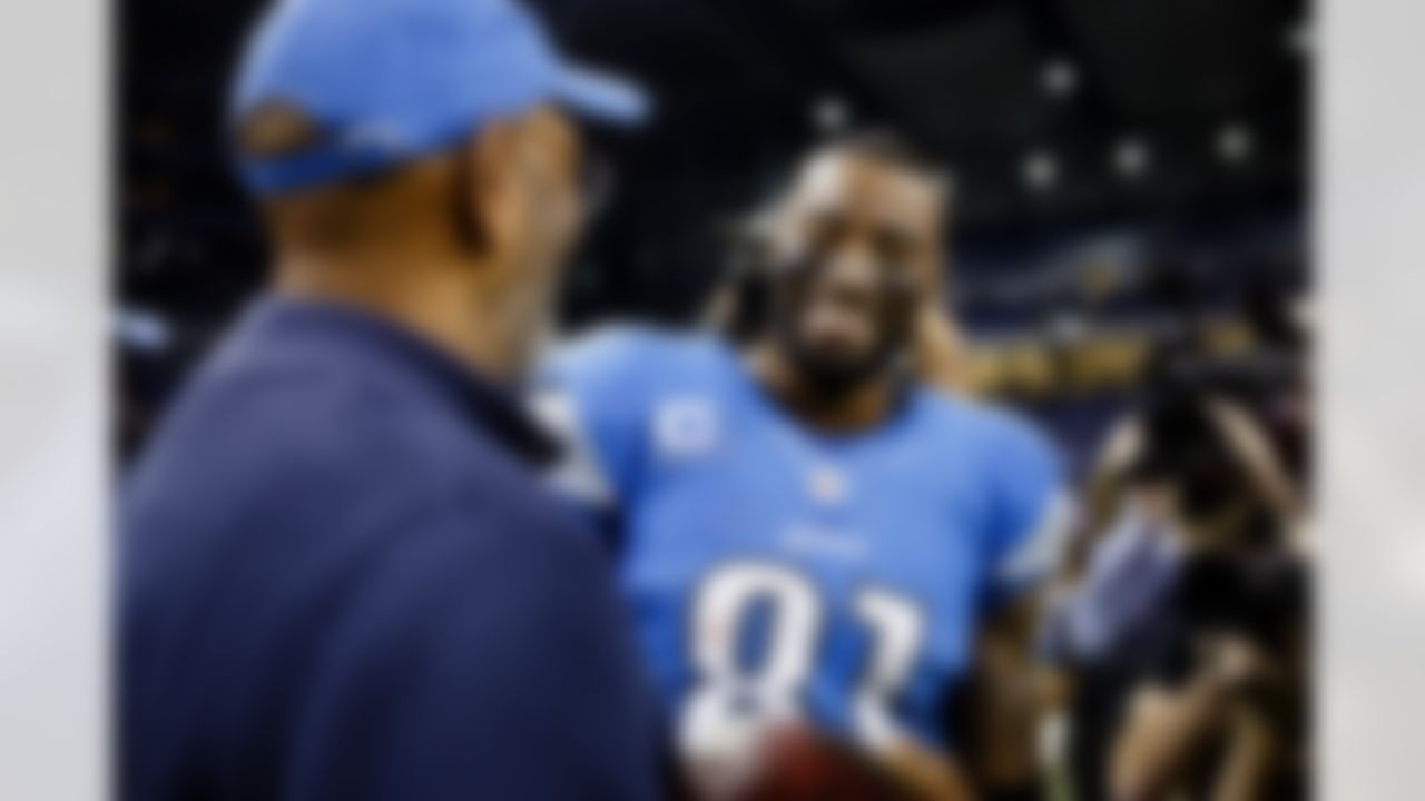 Detroit Lions wide receiver Calvin Johnson (81) and his father, Calvin Sr. after an NFL football game against the Atlanta Falcons at Ford Field in Detroit, Saturday, Dec. 22, 2012. (AP Photo/Rick Osentoski)