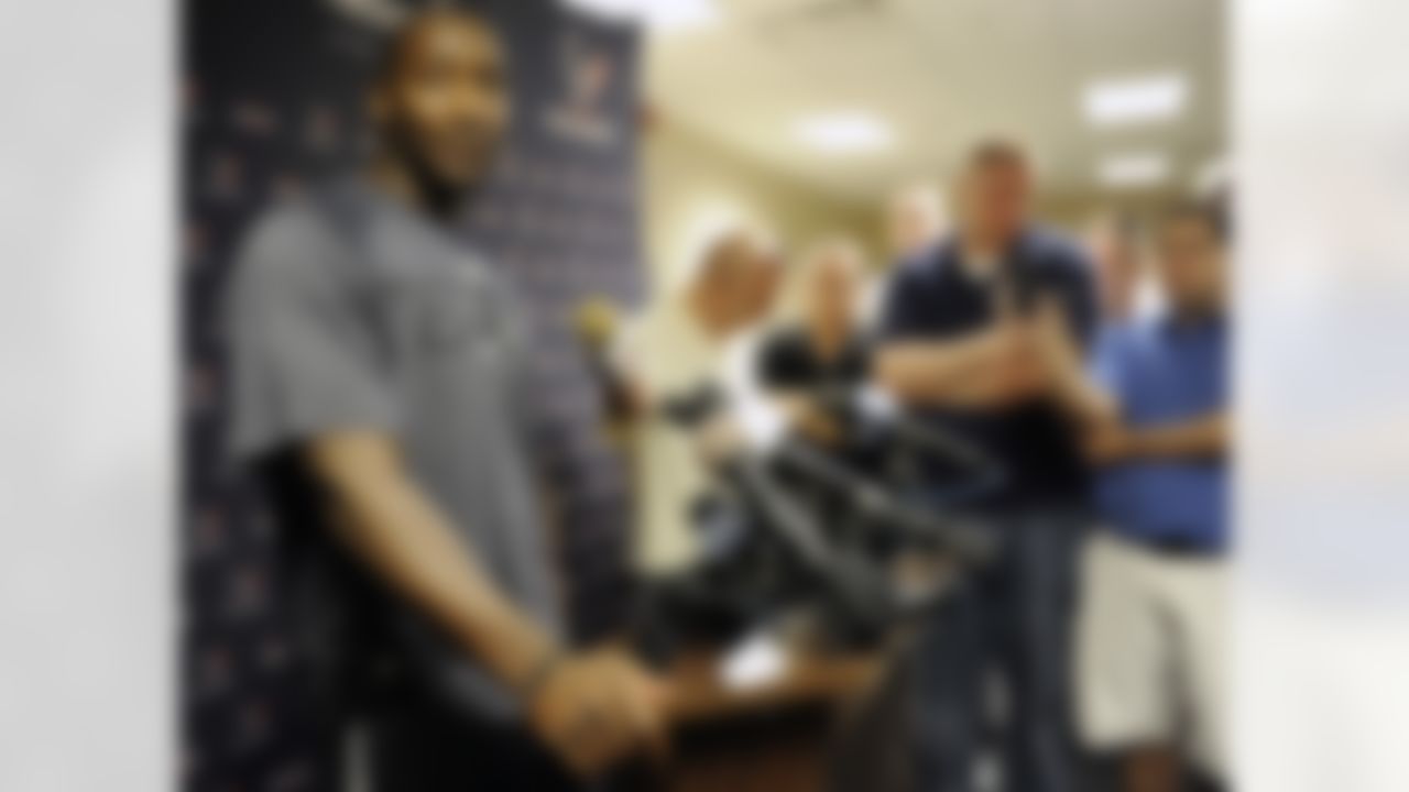 Houston Texans' Antonio Smith faces the media as he reports for training camp Friday, July 27, 2012, in Houston. The Texans went 10-6 last season and won its first playoff game in 2011 resulting in higher-than-ever expectations. (AP Photo/Pat Sullivan)