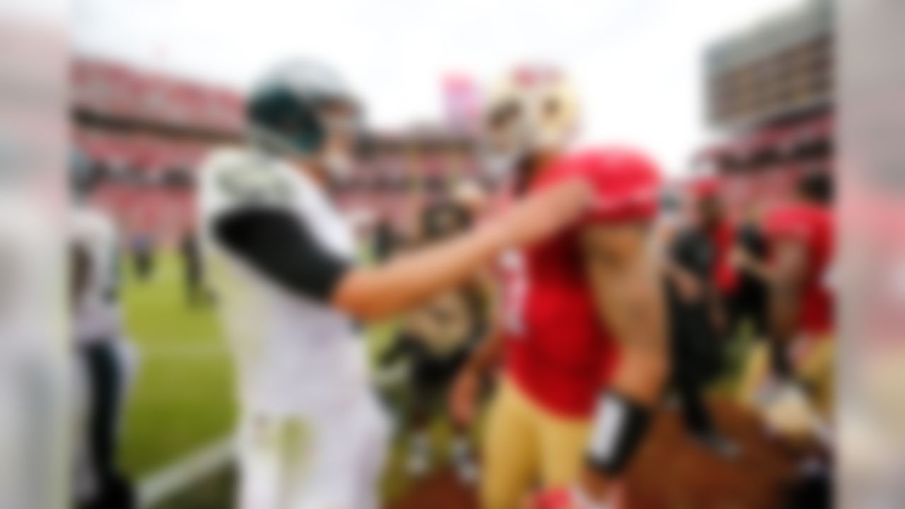 Philadelphia Eagles quarterback Nick Foles (9) talks with San Francisco 49ers quarterback Colin Kaepernick (7) after the NFL regular season game against the Philadelphia Eagles and the San Francisco 49ers on Sunday, Sept. 28, 2014 at the Levi's Stadium in Santa Clara, Calif. (Ric Tapia/NFL)