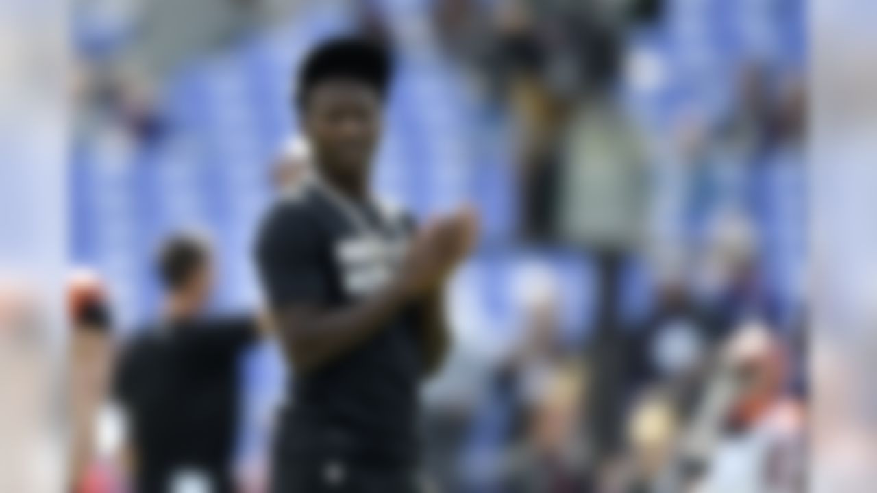 Baltimore Ravens wide receiver Marquise Brown looks on as his team works out prior to an NFL football game against the Cincinnati Bengals Sunday, Oct. 13, 2019, in Baltimore. Brown is inactive for the contest. (AP Photo/Gail Burton)