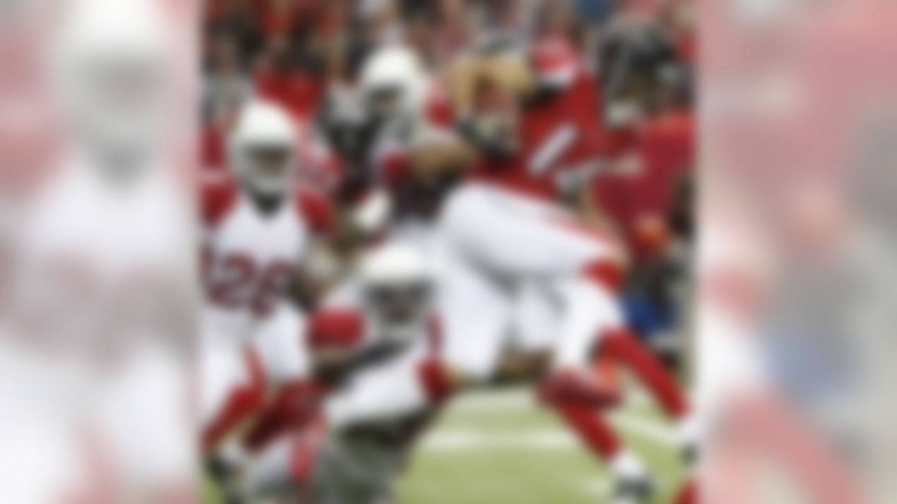 Atlanta Falcons wide receiver Eric Weems (14) runs against Arizona Cardinals running back Kerwynn Williams (33) during the first of an NFL football game, Sunday, Nov. 27, 2016, in Atlanta. (AP Photo/John Bazemore)