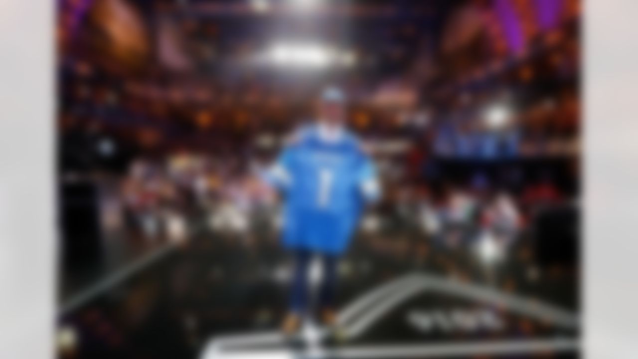 Ohio State offensive tackle Taylor Decker holds up his jersey after being drafted by the Detroit Lions during the 2016 NFL Draft at the Auditorium Theatre on Thursday, April 28, 2016 in Chicago. (Ben Liebenberg/NFL)