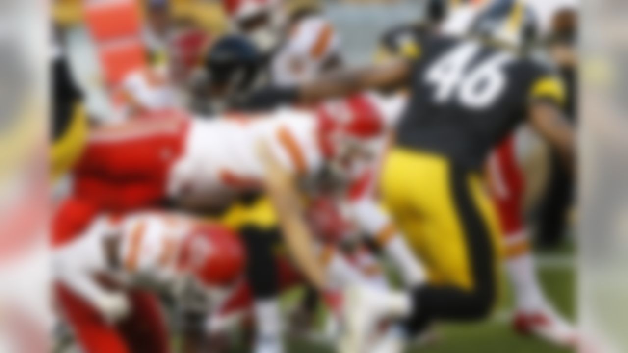 Kansas City Chiefs' Devon Wylie (19) dives for more yardage as he returns the opening kickoff, in front of Pittsburgh Steelers' Will Johnson (46) in the first quarter of an NFL preseason football game, Saturday, Aug. 24, 2013 in Pittsburgh. Wylie lost the ball on the tackle and Steelers' Chris Carter) recovered but the recovery was overturned on review. (AP Photo/Keith Srakocic)