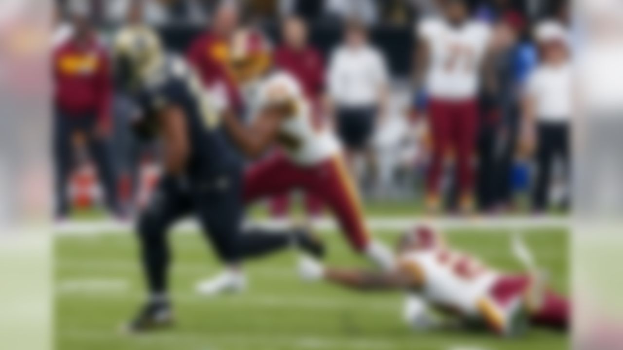 New Orleans Saints running back Mark Ingram (22) rushes for a touchdown past Washington Redskins free safety DeAngelo Hall (23) and cornerback Josh Norman (24) in the first half of an NFL football game in New Orleans, Sunday, Nov. 19, 2017. (AP Photo/Butch Dill)