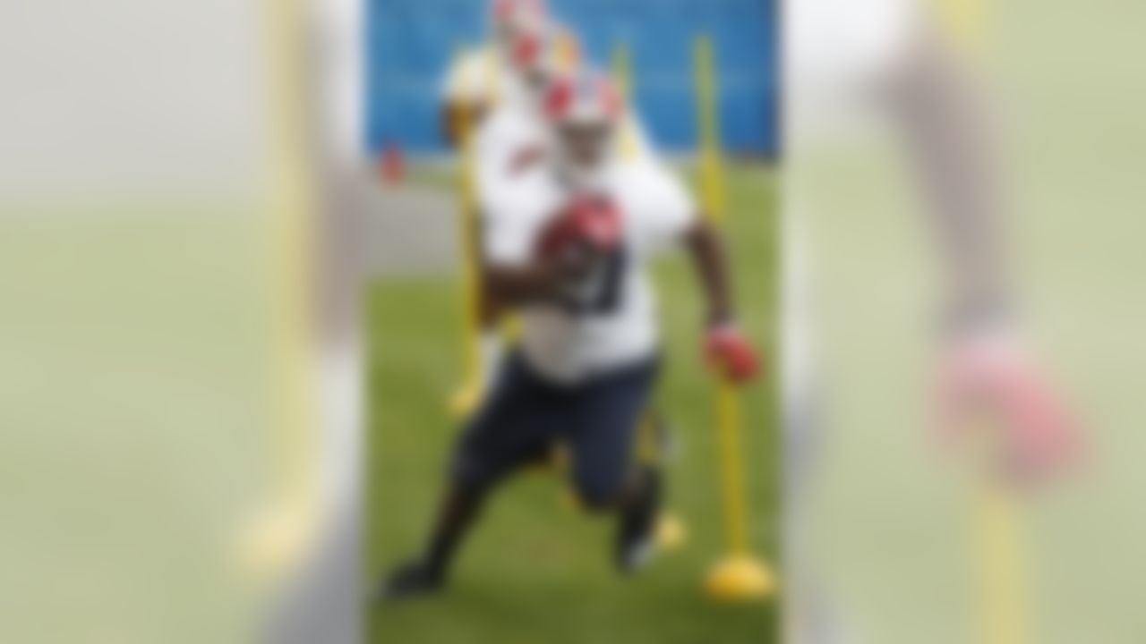 Buffalo Bills running back C. J. Spiller (21) runs a drill during NFL football rookie mini-camp in Orchard Park, N.Y., Friday, May 7, 2010. (AP Photo/David Duprey)