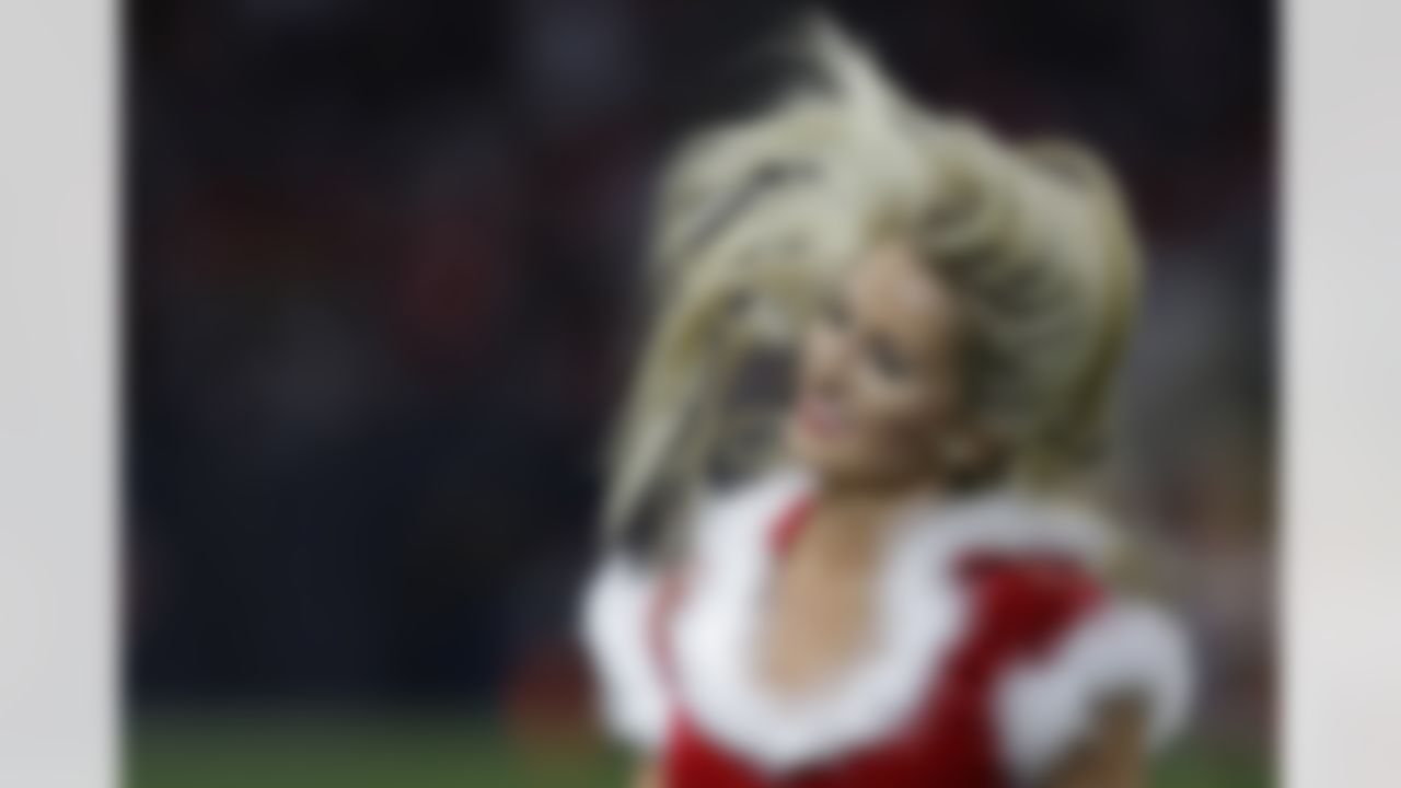 A Houston Texans cheerleader performs during the second half of an NFL football game against the Baltimore Ravens Sunday, Dec. 21, 2014, in Houston. (AP Photo/Patric Schneider)
