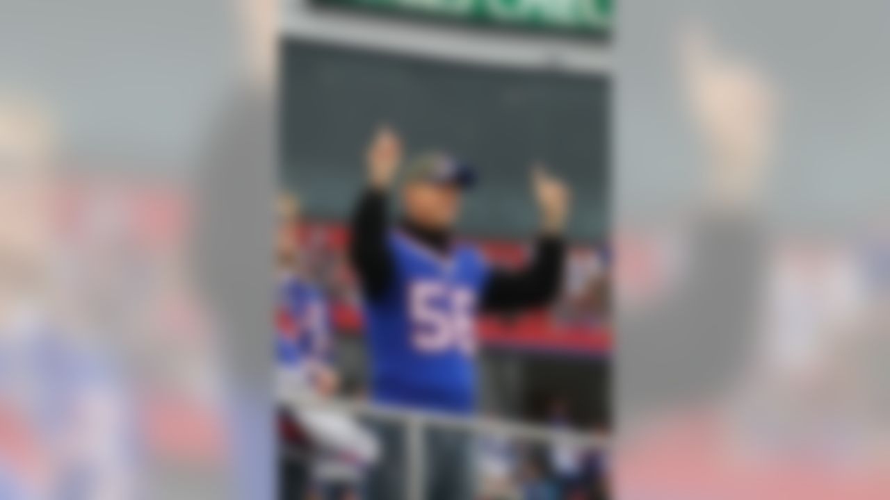 Former Buffalo Bills quarterback Jim Kelly gestures prior to an NFL football game between the Buffalo Bills and the Cleveland Browns, Sunday, Nov. 30, 2014, in Orchard Park, N.J. (AP Photo/Bill Wippert)