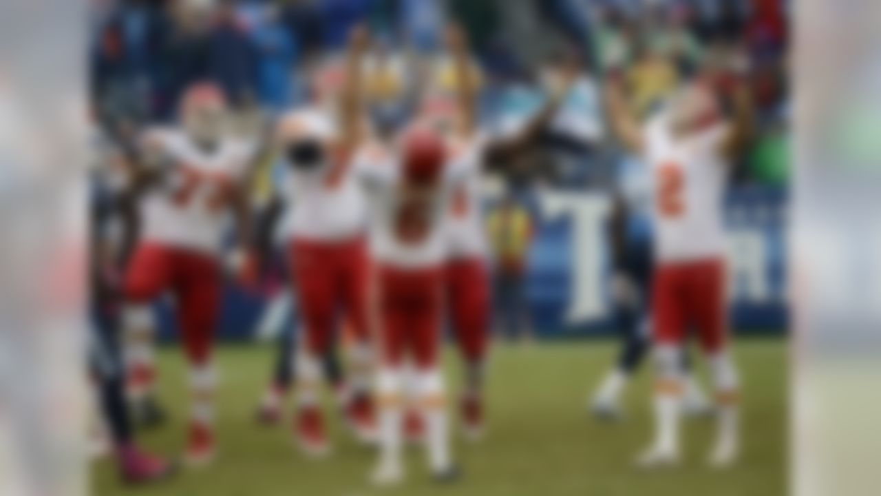 Kansas City Chiefs kicker Ryan Succop (6) and holder Dustin Colquitt (2) celebrate after Succop made a 48-yard field goal to seal a 26-17 win over the Tennessee Titans in the final minutes of the fourth quarter of an NFL football game on Sunday, Oct. 6, 2013, in Nashville, Tenn. (AP Photo/Mark Zaleski)