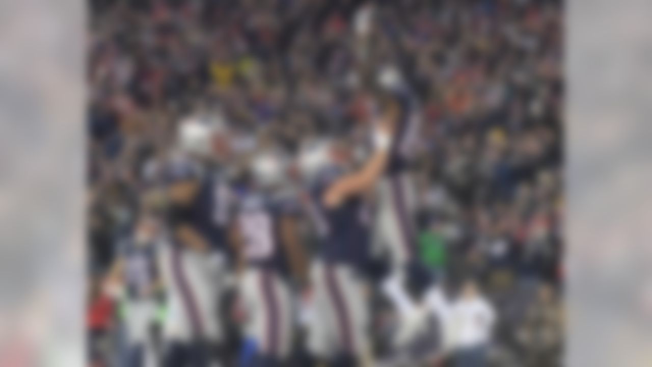 New England Patriots wide receiver Malcolm Mitchell (19)  celebrates with center David Andrews (60) after scoring on a 6-yard touchdown pass in the second quarter against the Baltimore Ravens during a NFL football game in Foxboro, Mass. on Monday, Dec. 12, 2016. The Patriots defeated the Ravens 30-23.  (Kirby Lee/NFL)