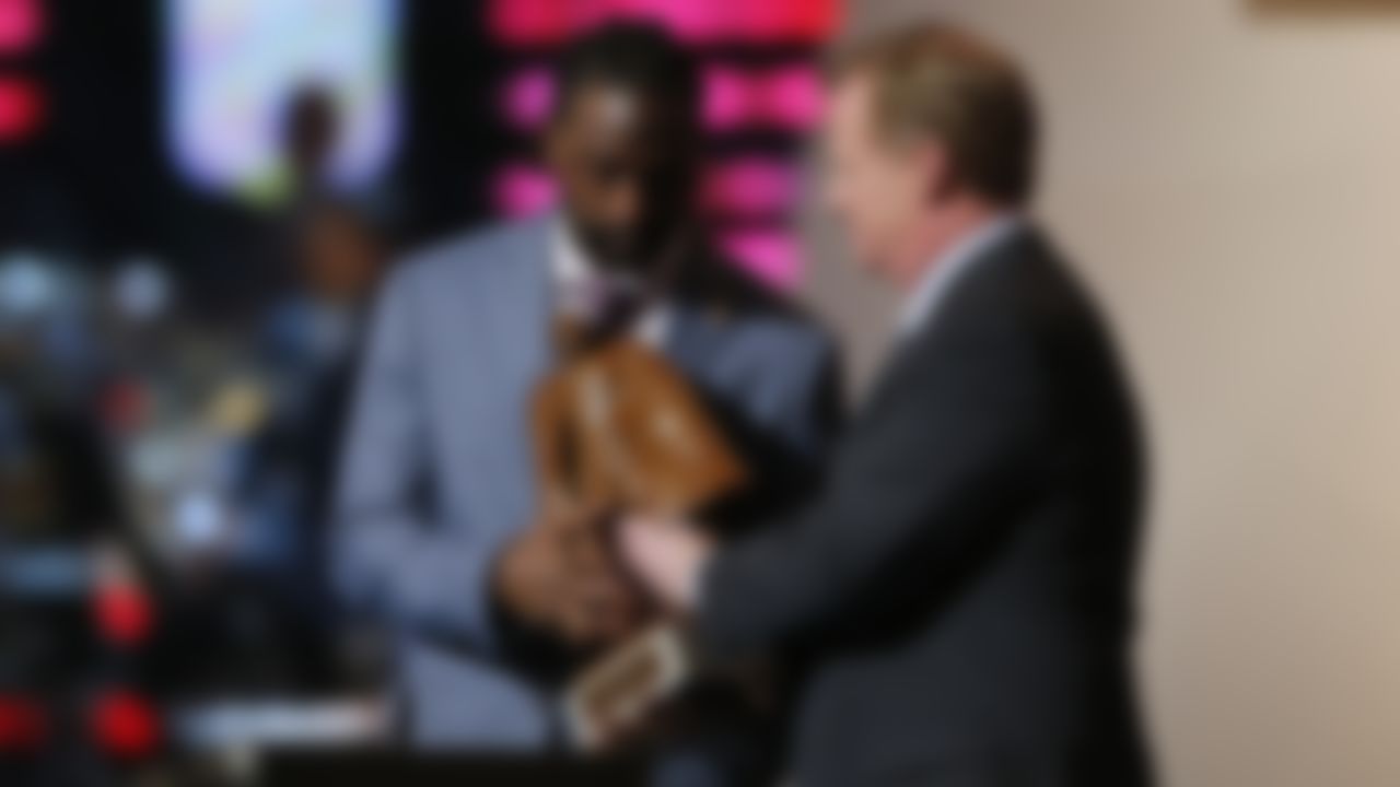 Charles Tillman of the Chicago Bears accepts the Walter Payton NFL Man of the Year award from NFL commissioner Roger Goodell during the 3rd annual NFL Honors at Radio City Music Hall on Saturday, Feb. 1, 2014, in New York.