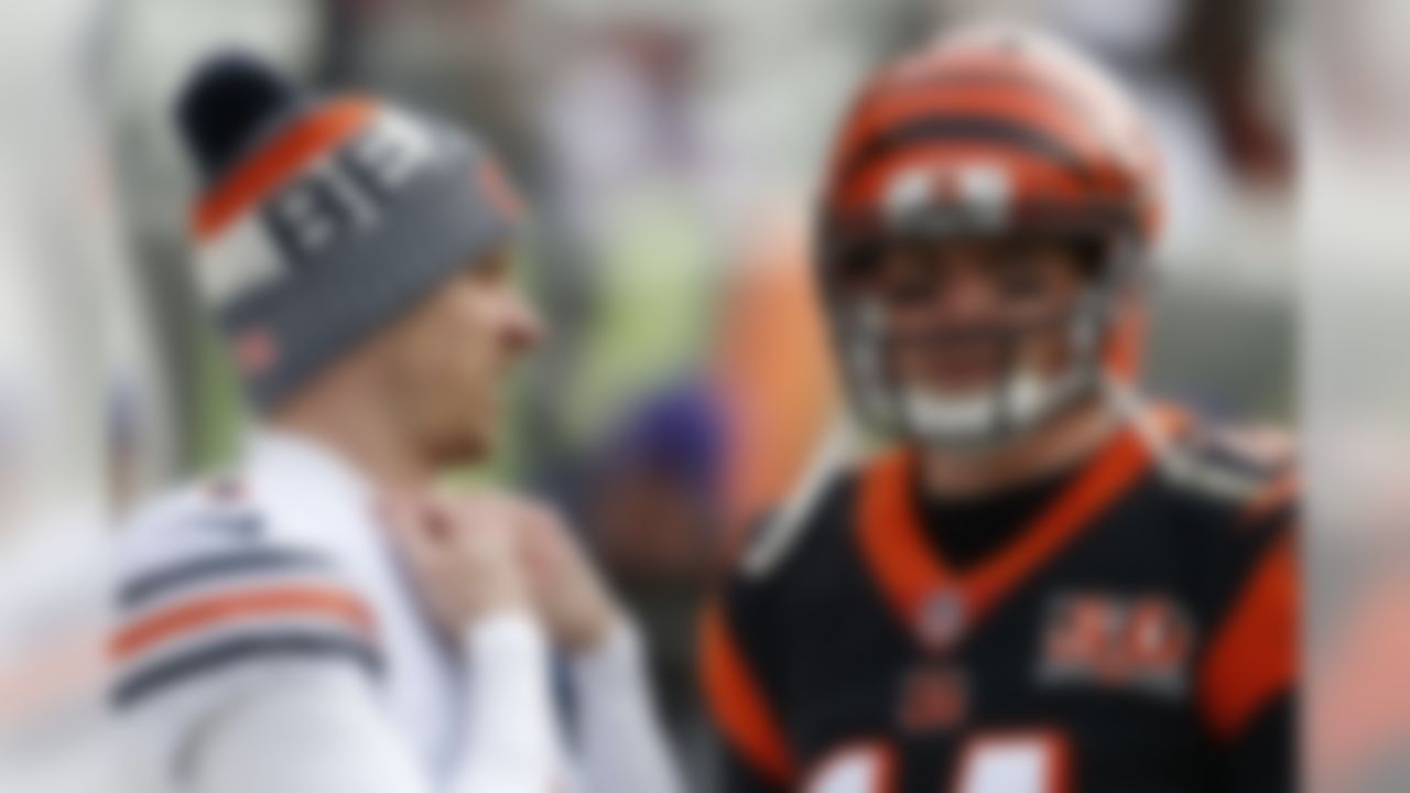 Chicago Bears kicker Mike Nugent, left, meets with Cincinnati Bengals quarterback Andy Dalton (14) before an NFL football game, Sunday, Dec. 10, 2017, in Cincinnati. (AP Photo/Gary Landers)