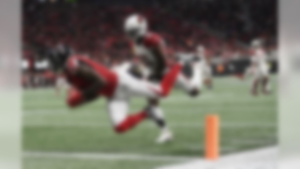 Atlanta Falcons wide receiver Julio Jones (11) makes a touchdown catch against Arizona Cardinals cornerback Patrick Peterson (21) during the first half of an NFL football game, Sunday, Dec. 16, 2018, in Atlanta. (AP Photo/Danny Karnik)