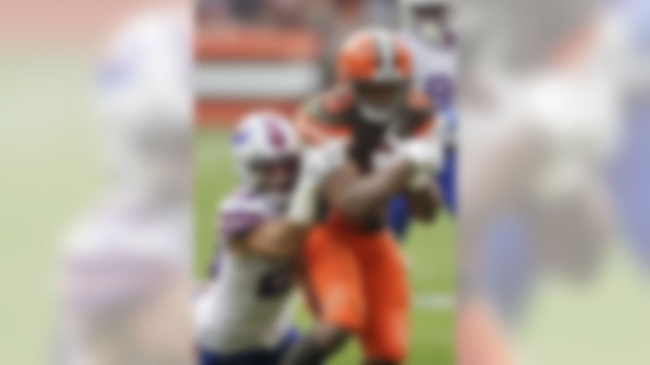 Cleveland Browns running back Nick Chubb (24) is tackled by Buffalo Bills strong safety Micah Hyde (23) during the first half of an NFL football game, Sunday, Nov. 10, 2019, in Cleveland. (AP Photo/Ron Schwane)