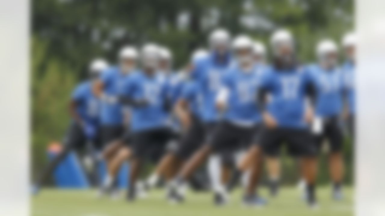 The Detroit Lions run through drills during NFL football training camp in Allen Park, Mich., Saturday, July 31, 2010. (AP Photo/Carlos Osorio)