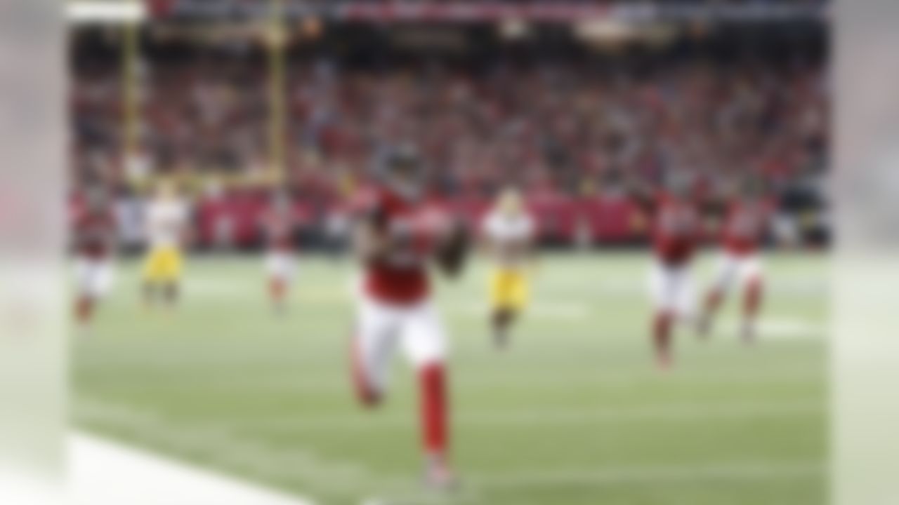 Atlanta Falcons cornerback Robert Alford (23) runs back an intercepted ball during the overtime of an NFL football game against the Washington Redskins, Sunday, Oct. 11, 2015, in Atlanta. The Atlanta Falcons won 25-19. (AP Photo/John Bazemore)