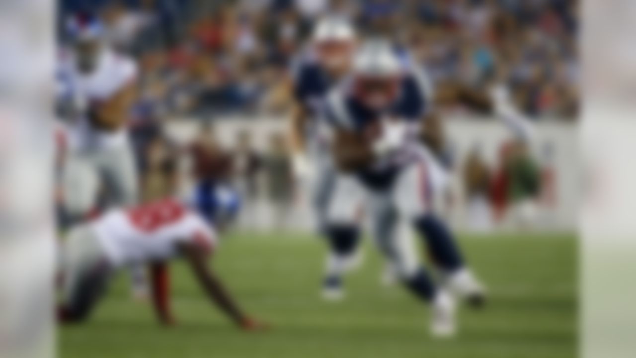 New England Patriots running back LeShun Daniels (39) runs past New York Giants defensive back Donte Deayon (38) during the first half of an NFL preseason football game, Thursday, Aug. 31, 2017, in Foxborough, Mass. (AP Photo/Winslow Townson)