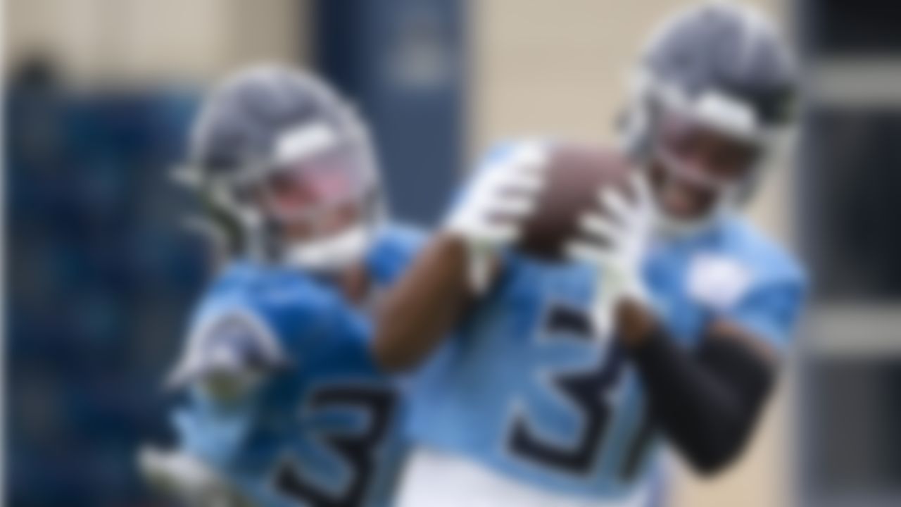Tennessee Titans safety Kevin Byard (31) pulls in a pass against safety Amani Hooker, left, during an NFL football practice Thursday, June 10, 2021, in Nashville, Tenn.