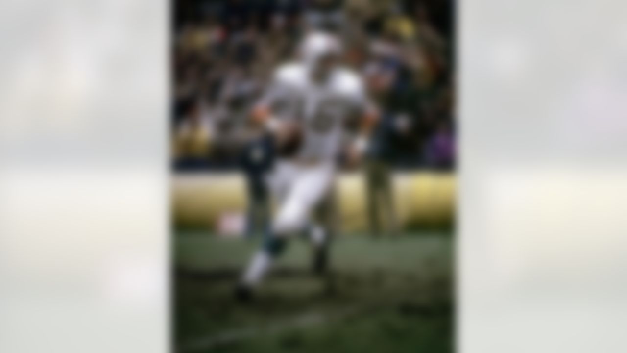 Miami Dolphins quarterback Earl Morrall (15) rolls out and looks for an open receiver during the Dolphins 23-13 victory over the New York Giants on December 10, 1972 at Yankee Stadium in New York, New York. (National Football League)