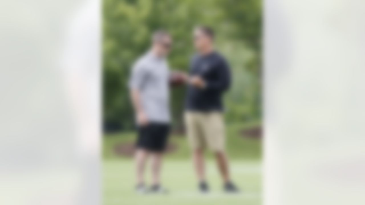 Detroit Lions president Tom Lewand, left, talks with head coach Jim Schwartz during NFL football minicamp at the teams' training facility in Allen Park, Mich., Thursday, June 24, 2010. (AP Photo/Carlos Osorio)