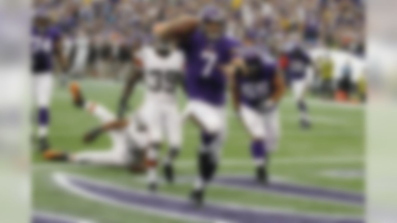 Minnesota Vikings quarterback Christian Ponder (7) celebrates after scoring on a 6-yard touchdown run during the first half of an NFL football game against the Cleveland Browns Sunday, Sept. 22, 2013, in Minneapolis. (AP Photo/Ann Heisenfelt)