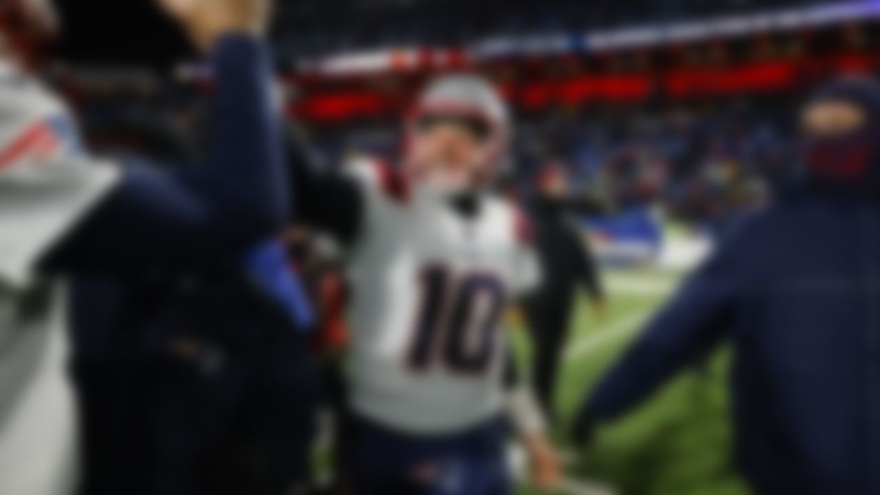 New England Patriots quarterback Mac Jones (10) celebrates after winning an NFL football game against the Buffalo Bills on Monday, December 6, 2021 in Orchard Park, New York.