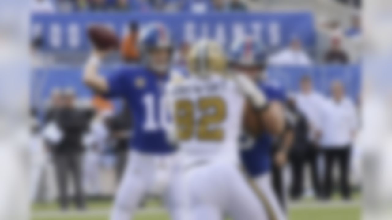 New York Giants quarterback Eli Manning, left, looks to throw during the first half of an NFL football game against the New Orleans Saints, Sunday, Sept. 30, 2018, in East Rutherford, N.J. (AP Photo/Bill Kostroun)