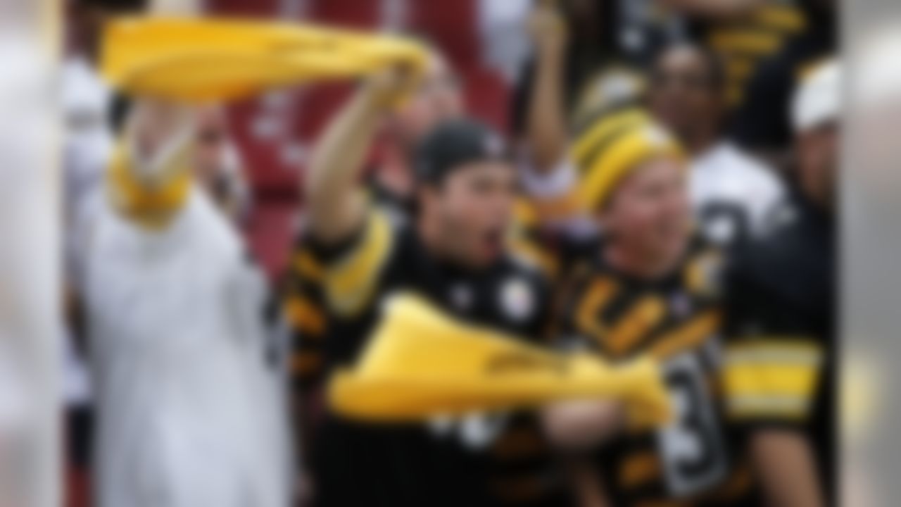 Pittsburgh Steelers fans cheer during warm ups before the start of an NFL football game between the St. Louis Rams and the Pittsburgh Steelers Sunday, Sept. 27, 2015, in St. Louis. (AP Photo/Billy Hurst)