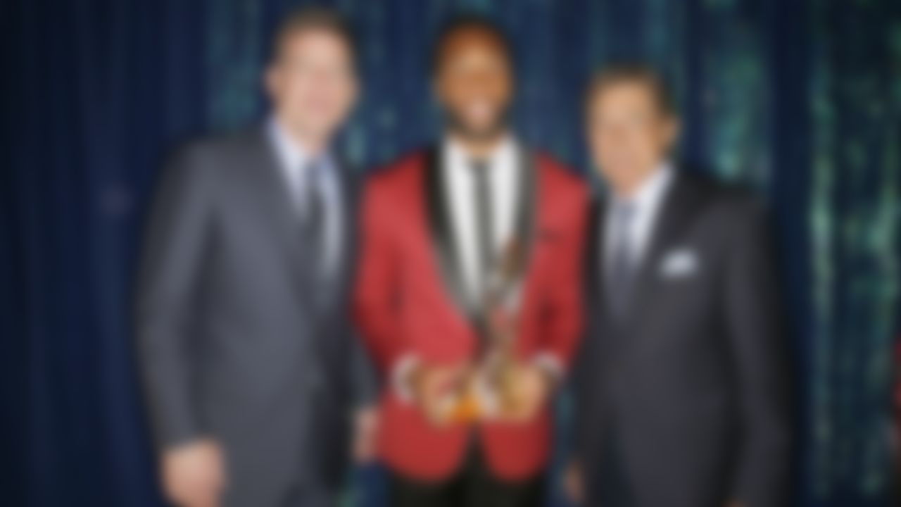 NFL Hall of Famers Troy Aikman (left) and Joe Namath (right) pose with Larry Fitzgerald backstage with the Art Rooney Award during the 4th Annual NFL Honors awards show at the Phoenix Symphony Hall on Saturday, January 31, 2015 in Phoenix, AZ.