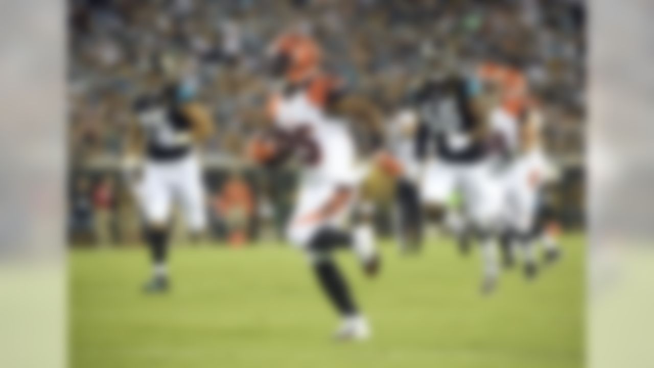 Cincinnati Bengals running back Giovani Bernard runs for a 19-yard touchdown on a pass play past Jacksonville Jaguars defensive end Jared Odrick (75) and defensive end Dante Fowler (56) during the first half of an NFL preseason football game in Jacksonville, Fla., Sunday, Aug. 28, 2016. (AP Photo/Phelan M. Ebenhack)