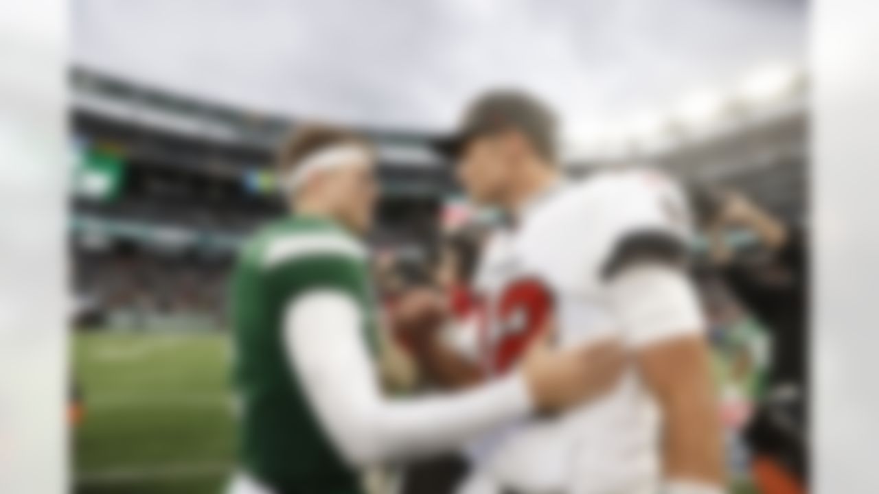 New York Jets quarterback Zach Wilson (2) talks with Tampa Bay Buccaneers quarterback Tom Brady (12) following an NFL football game on Sunday, January 2, 2022 in East Rutherford, New Jersey.