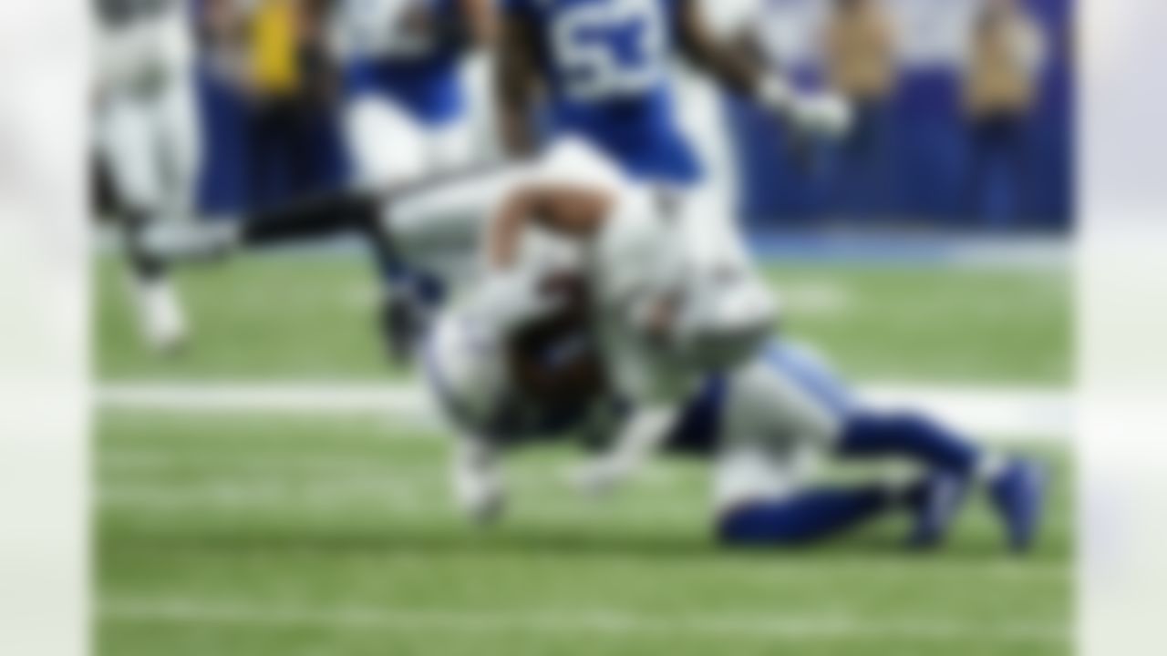 Las Vegas Raiders wide receiver Zay Jones (7) is tackled by Indianapolis Colts safety George Odum (30) after catching a pass during the first half of an NFL football game, Sunday, Jan. 2, 2022, in Indianapolis.