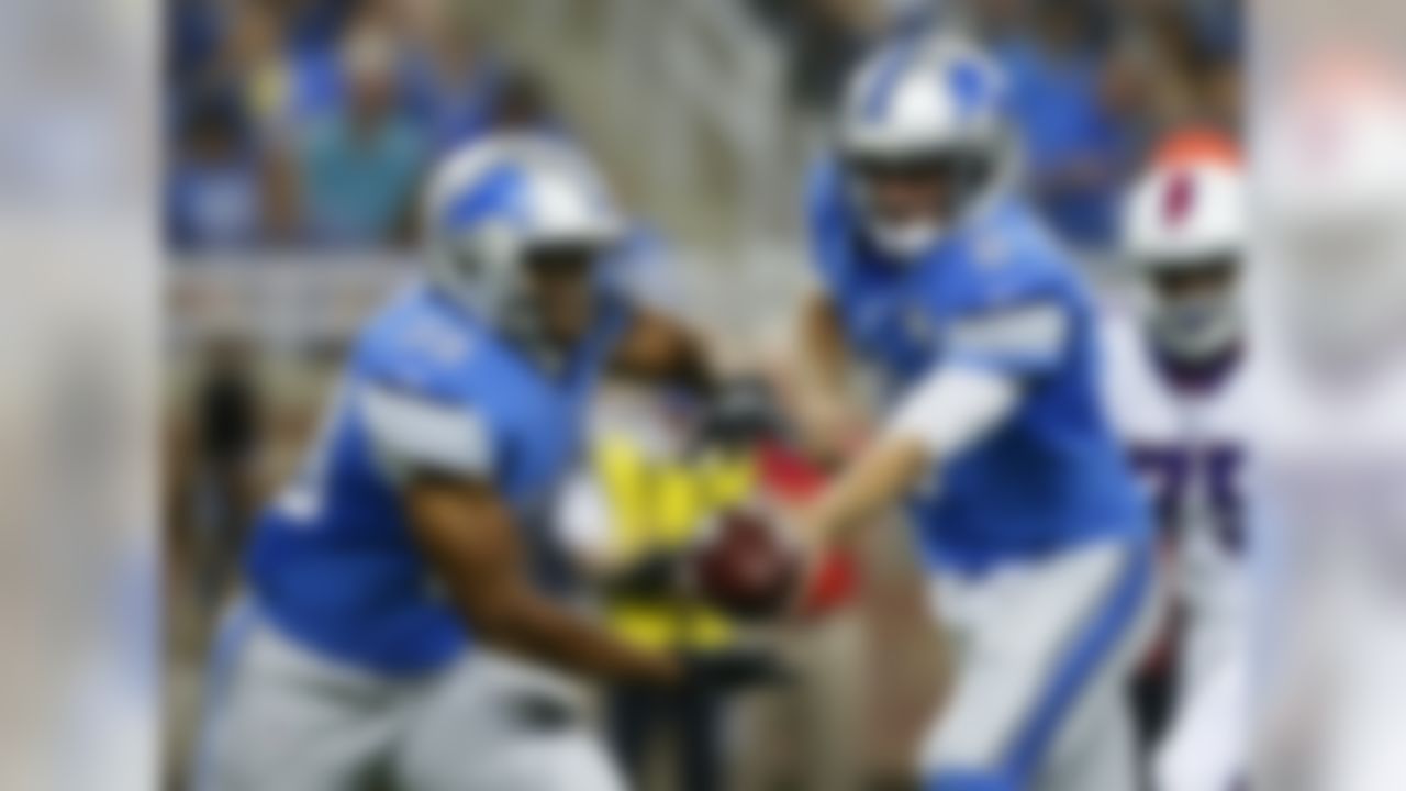 Detroit Lions quarterback Dan Orlovsky (8) hands off to Detroit Lions running back George Winn (38) during the first half of an NFL football game against the Buffalo Bills, Thursday, Sept. 3, 2015, in Detroit. (AP Photo/Rick Osentoski)