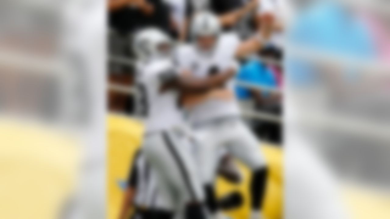 Oakland Raiders tight end Clive Walford (88) and Oakland Raiders quarterback Derek Carr (4) celebrate a touchdown during the NFL regular season game against the San Diego Chargers on Sunday, Oct. 25, 2015 in San Diego. (Ric Tapia/NFL)