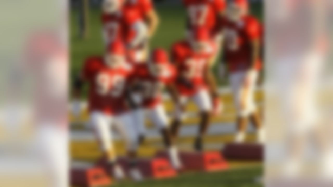 Kansas City Chiefs defensive tackle Derek Lokey (99) leads the defense through a drill during NFL football training camp in St. Joseph, Mo., Wednesday, Aug. 4, 2010. (AP Photo/Orlin Wagner)