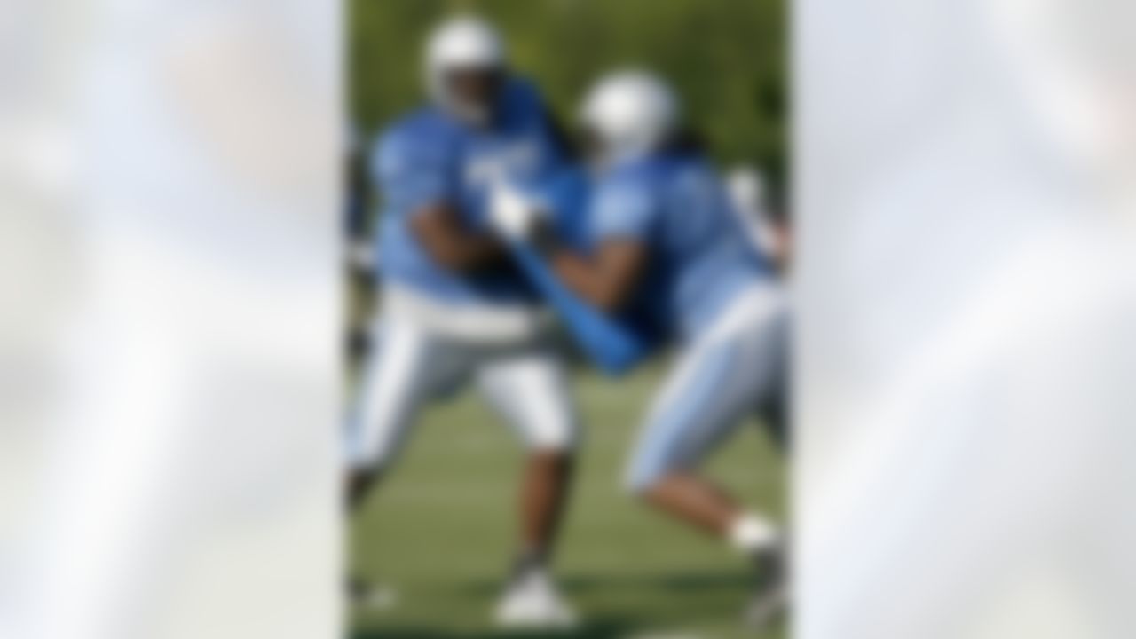 ALLEN PARK, MI - JULY 24: Gosder Cherilus #77 of the Detroit Lions does a blocking drill with George Foster #72 during training camp at the Detroit Lions Headquarters and Training Facility on July 24, 2008 in Allen Park, Michigan. (Photo by Gregory Shamus/Getty Images)