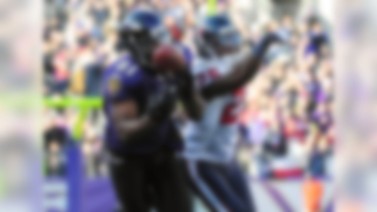 Jan 15, 2012; Baltimore, MD, USA; Baltimore Ravens wide receiver Anquan Boldin (81) makes a catch while being defend by Houston Texans cornerback Kareem Jackson (25) during the second quarter of the 2011 AFC divisional playoff game at M&T Bank Stadium. Mandatory Credit: Andrew Weber-US PRESSWIRE